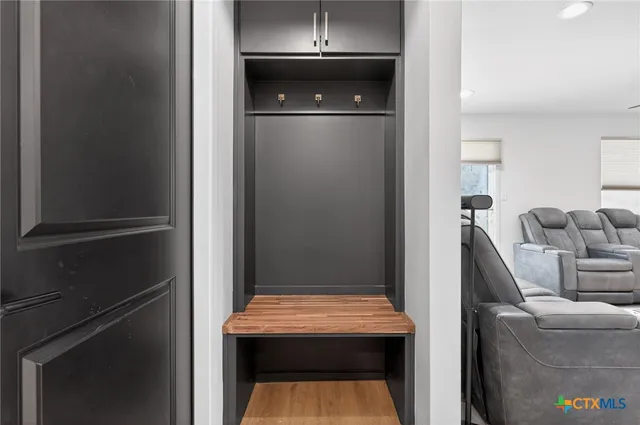 a room that has a door and a rug