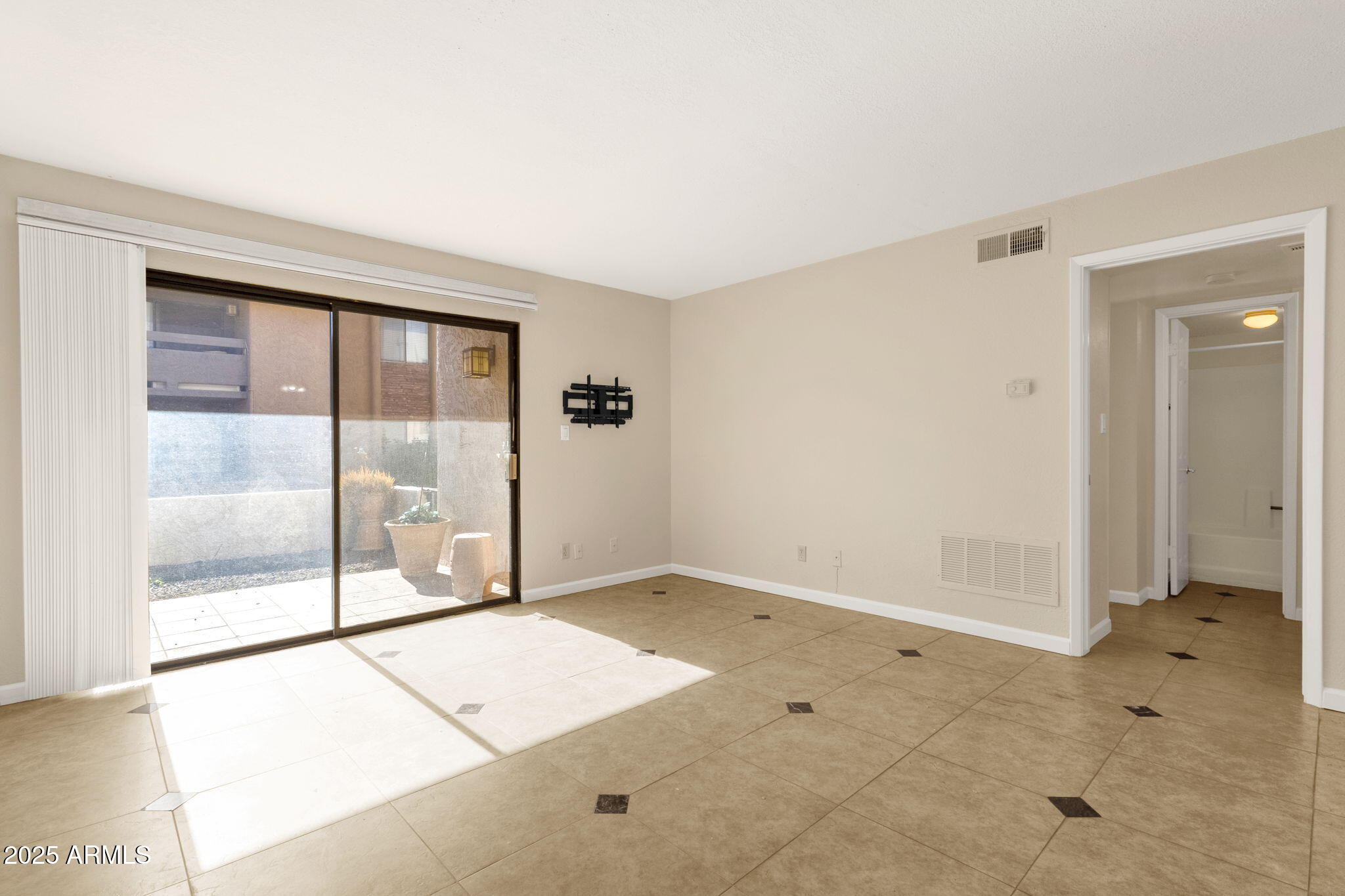 3825 East Camelback Road, Unit 120 Phoenix, AZ 85018 - Photo 12 of 39 a view of an empty room