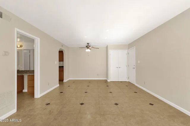 a view of a house with a ceiling fan and entryway