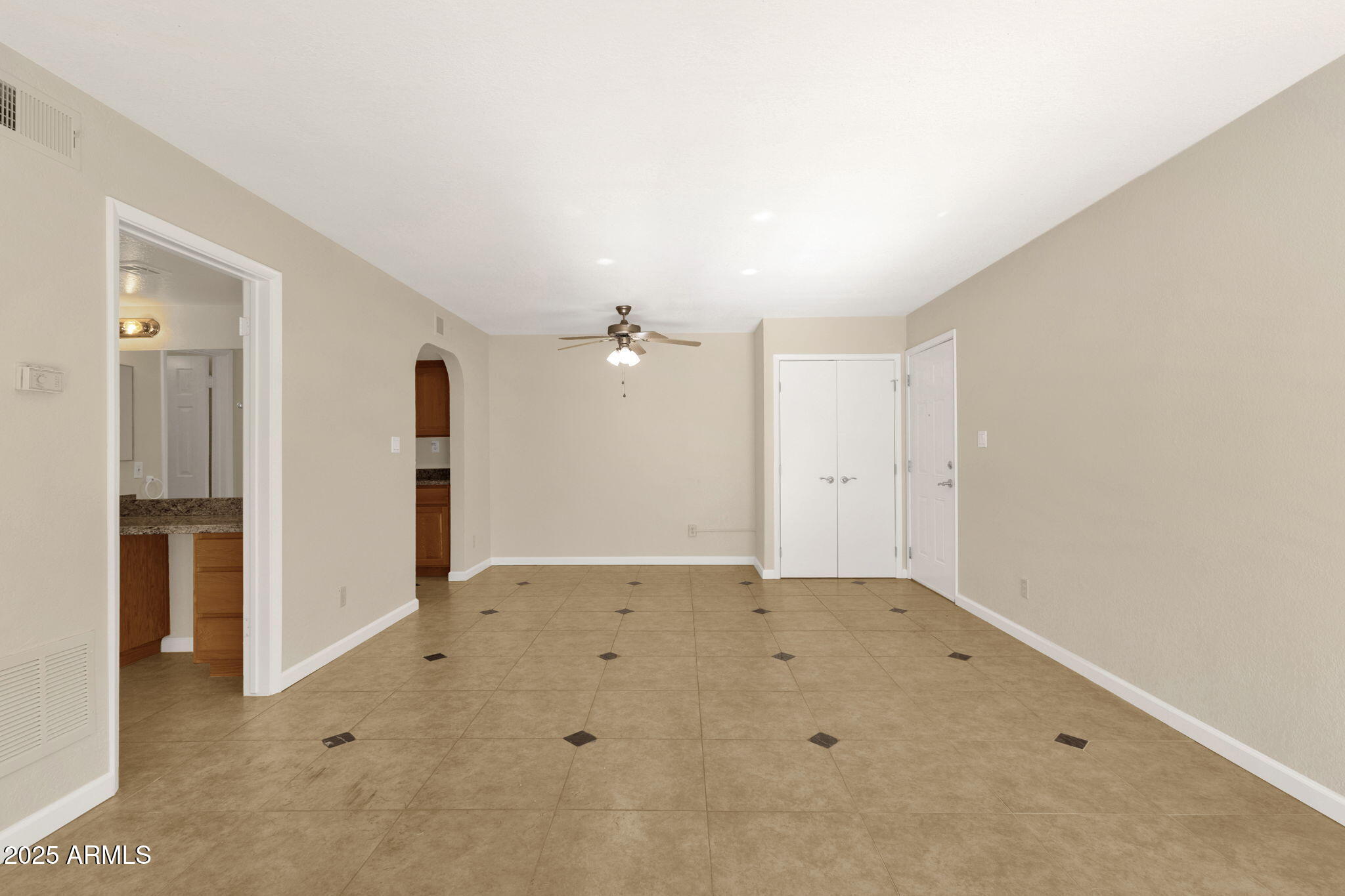 3825 East Camelback Road, Unit 120 Phoenix, AZ 85018 - Photo 14 of 39 an empty room with closet and a window