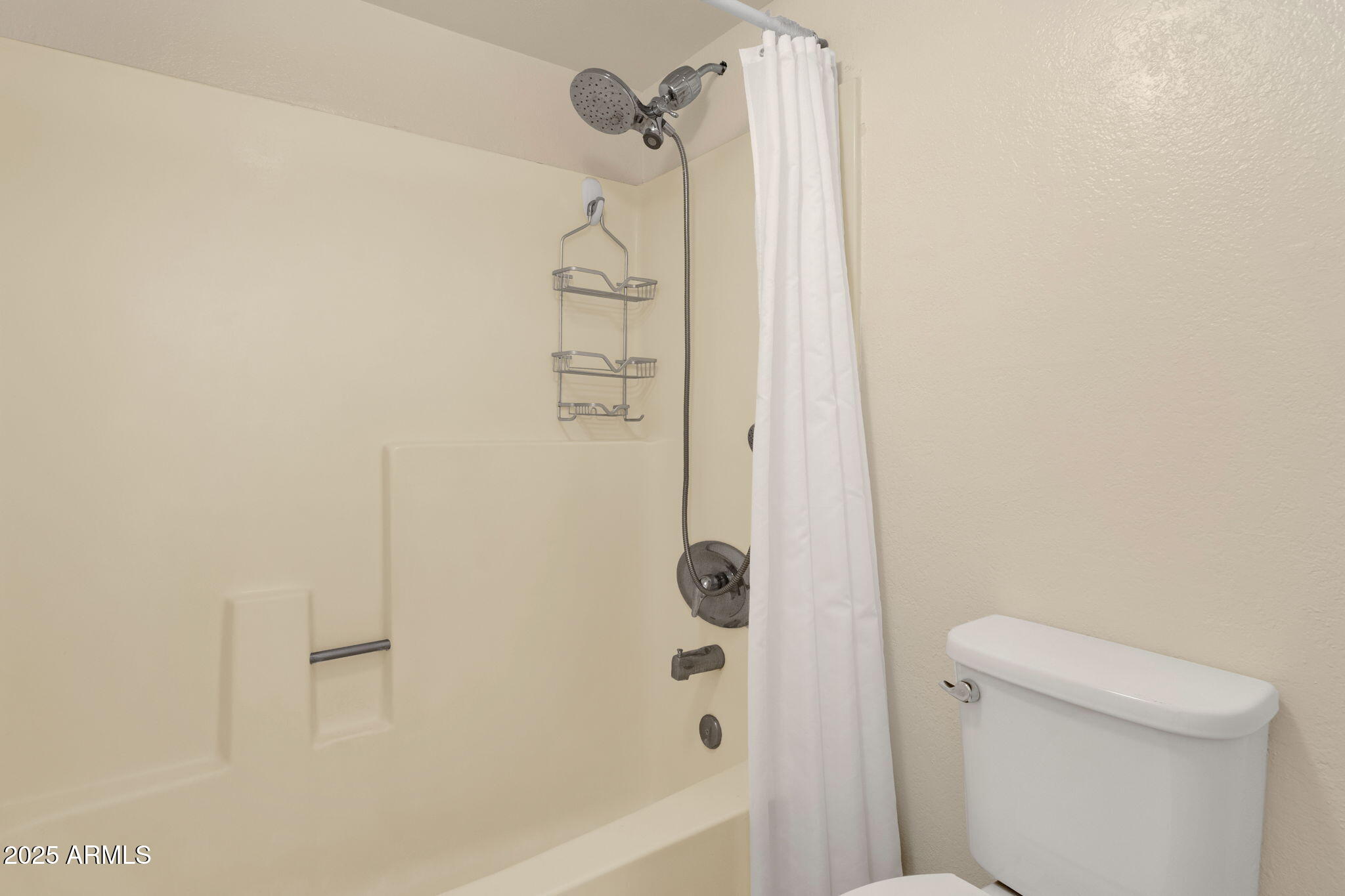 3825 East Camelback Road, Unit 120 Phoenix, AZ 85018 - Photo 21 of 39 a bathroom with a shower and a toilet