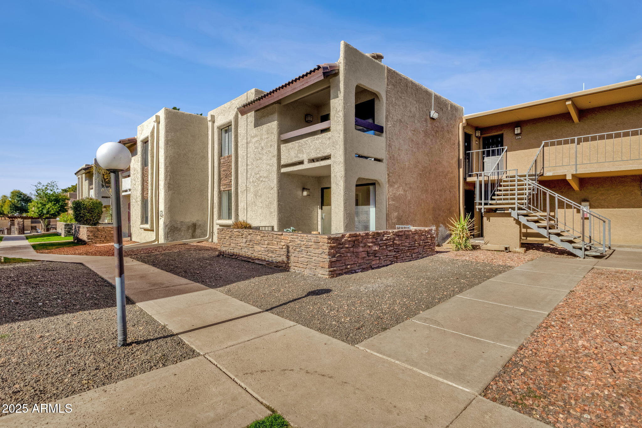 3825 East Camelback Road, Unit 120 Phoenix, AZ 85018 - Photo 28 of 39 a front view of a building with street view