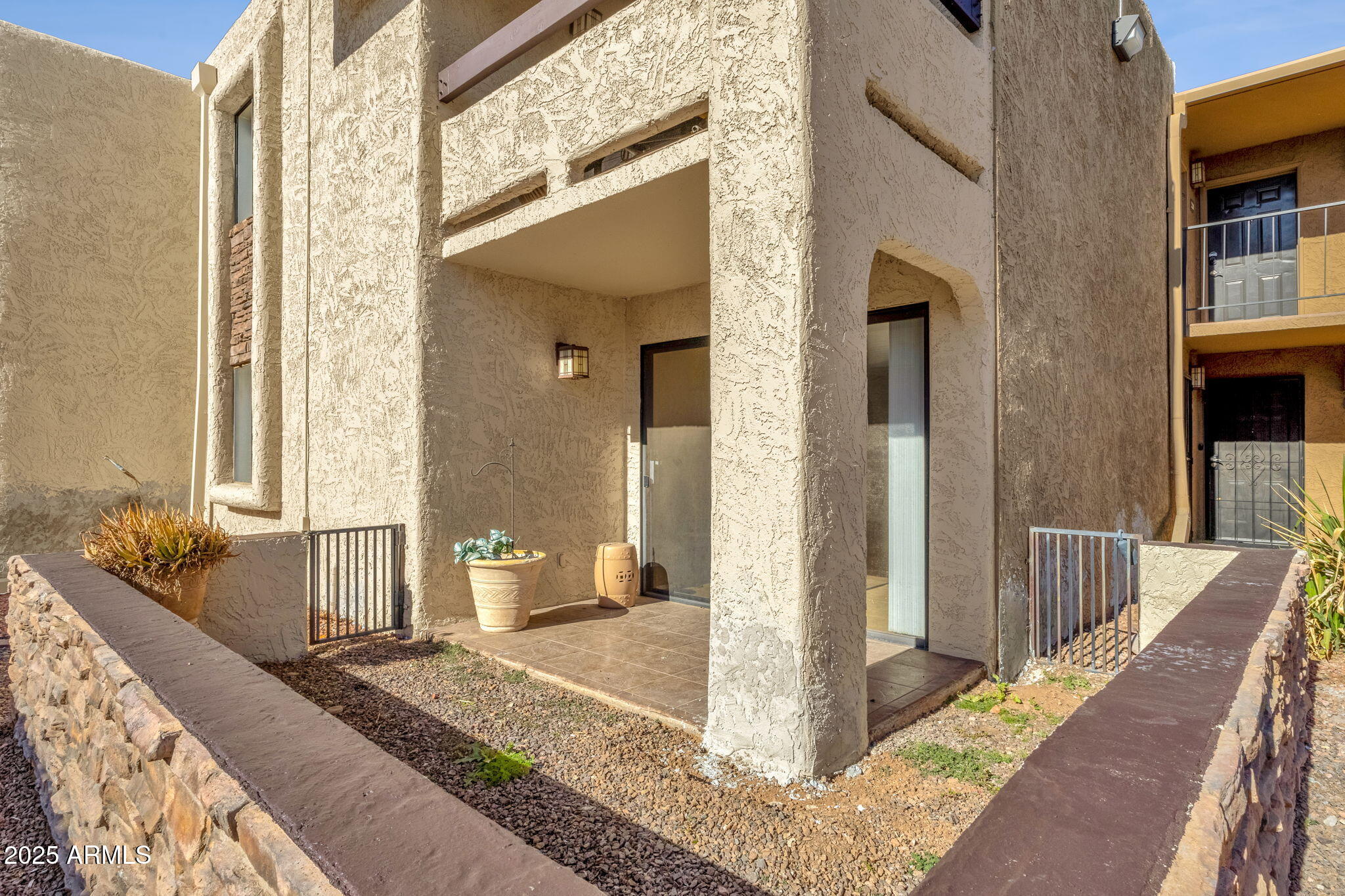 3825 East Camelback Road, Unit 120 Phoenix, AZ 85018 - Photo 29 of 39 a front view of a house with outdoor space