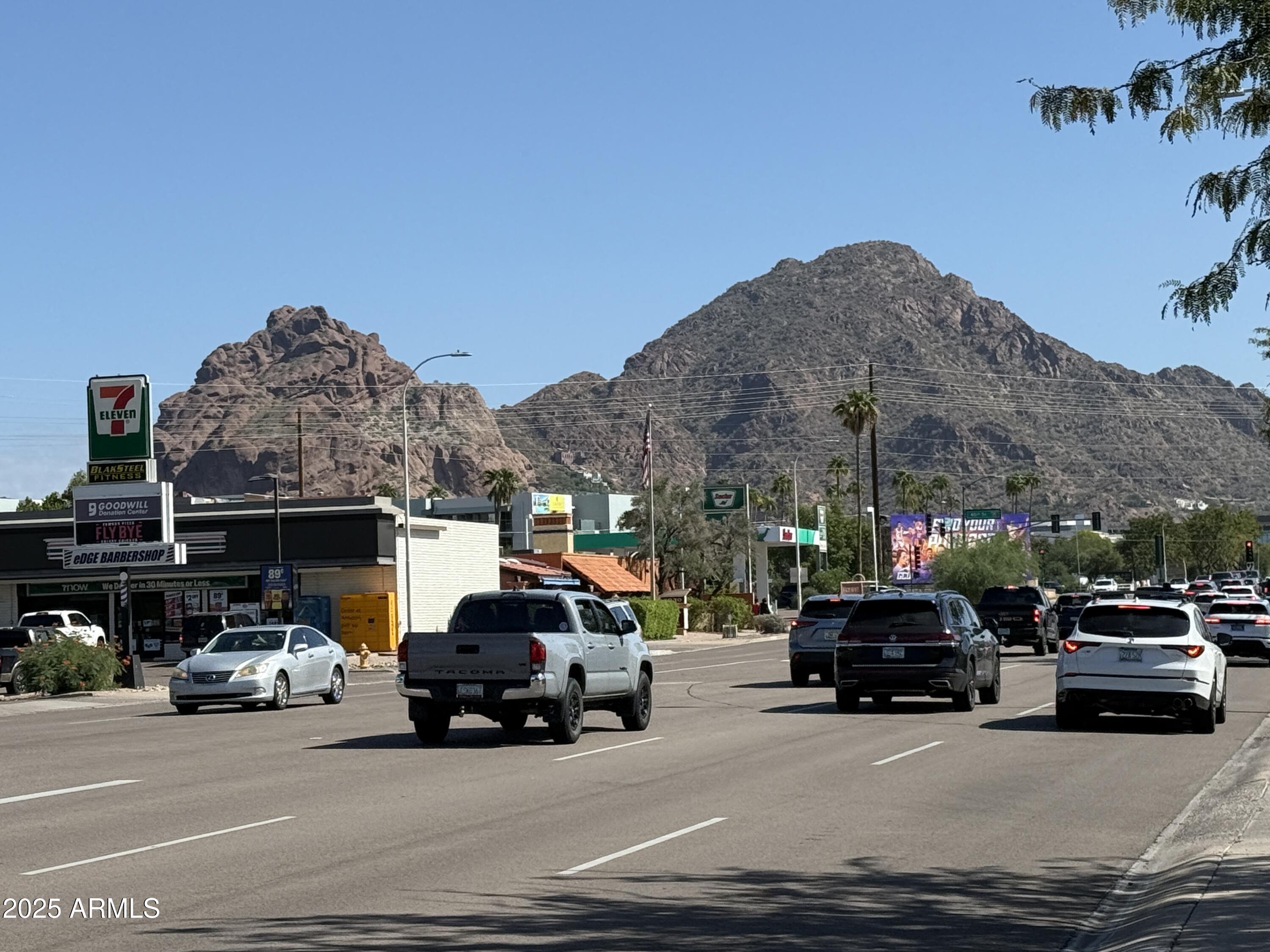 3825 East Camelback Road, Unit 120 Phoenix, AZ 85018 - Photo 2 of 39 a view of a cars parked in front of a house