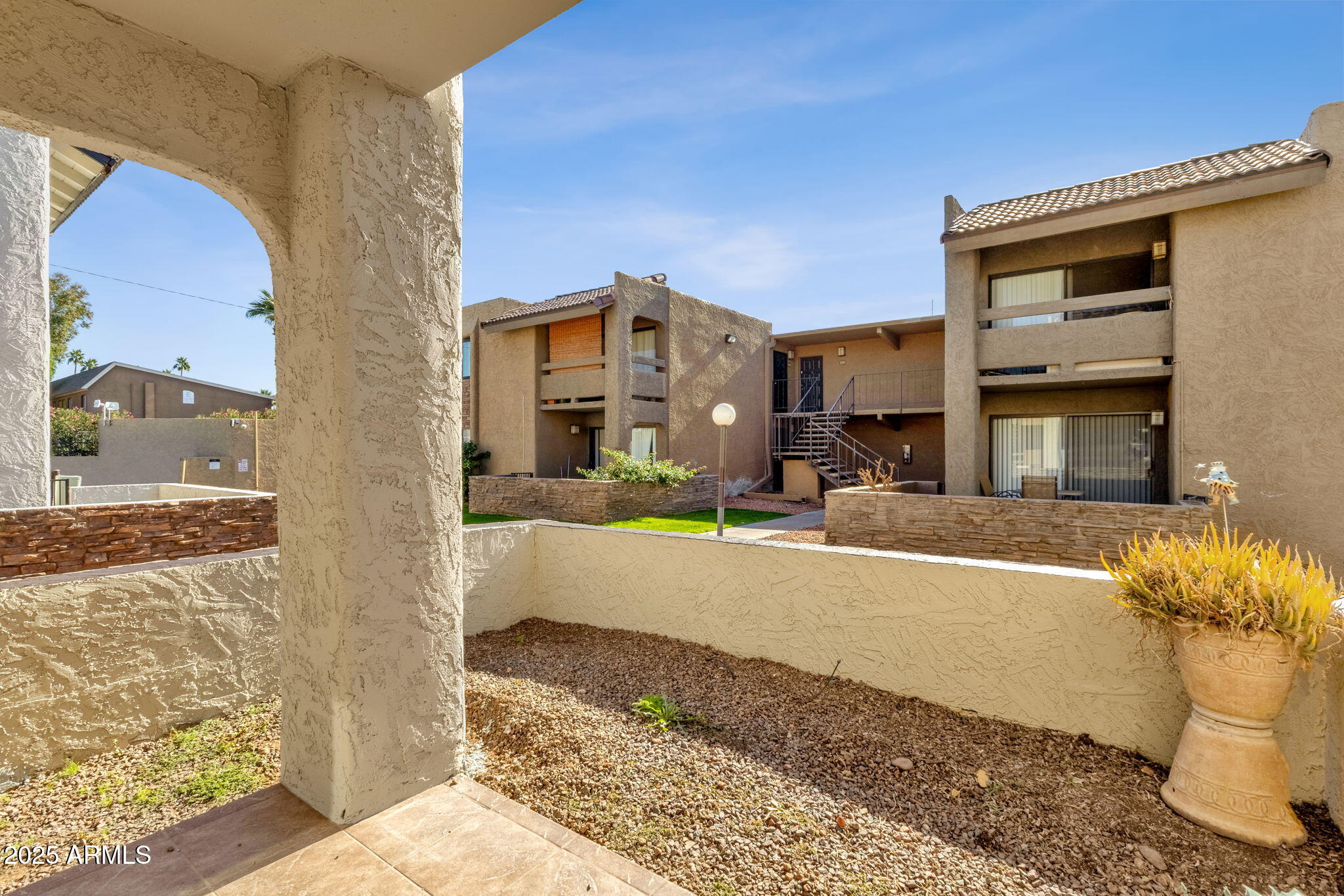 3825 East Camelback Road, Unit 120 Phoenix, AZ 85018 - Photo 31 of 39 a view of a building with a outdoor space