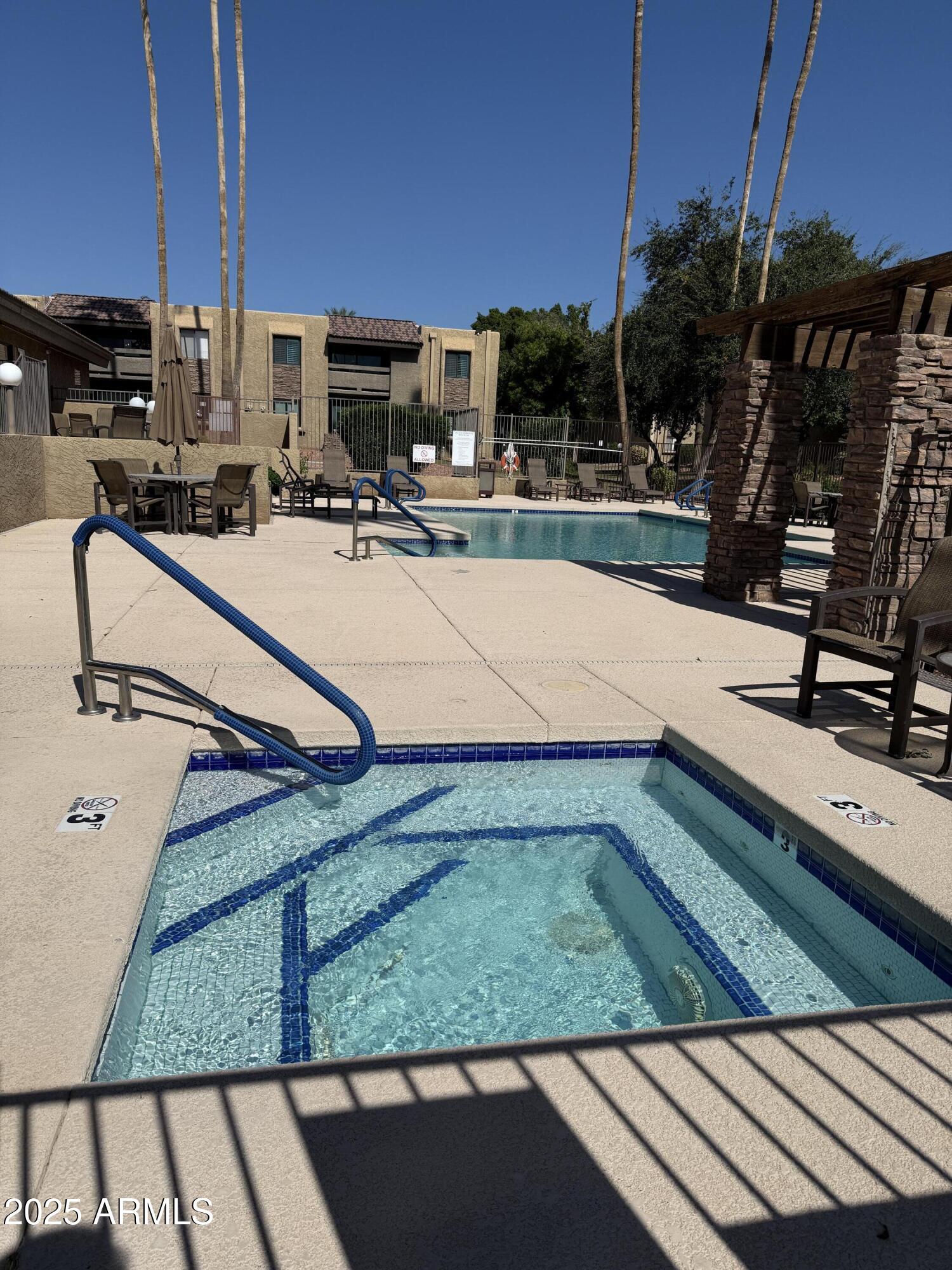 3825 East Camelback Road, Unit 120 Phoenix, AZ 85018 - Photo 33 of 39 a view of a terrace with chairs