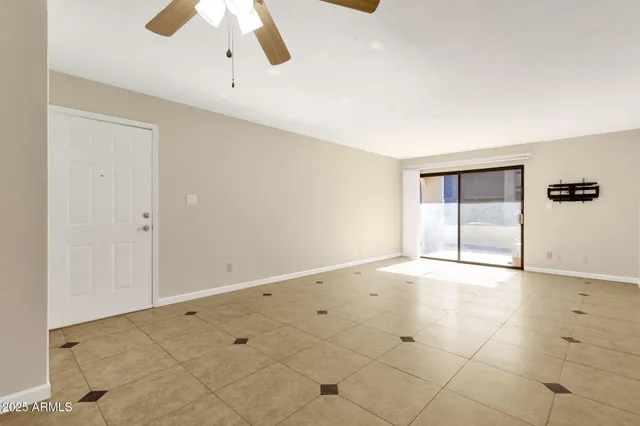 a kitchen with stainless steel appliances granite countertop a refrigerator a stove and a sink