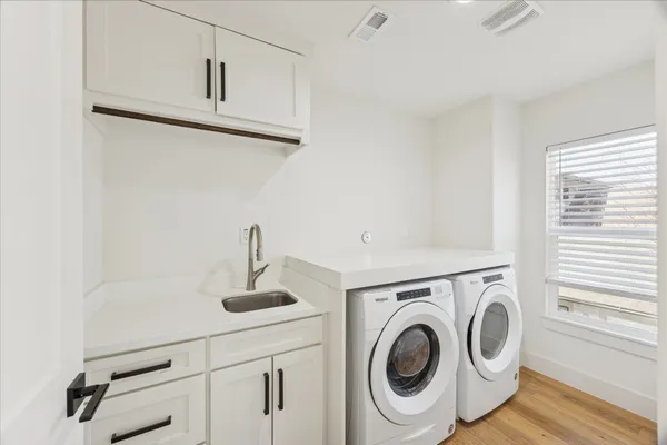 a view of storage and utility room with washer and dryer