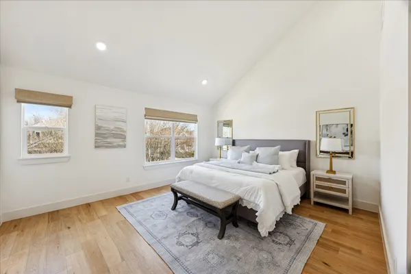 a bedroom with a bed and a night stand