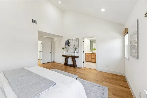 a bedroom with a bed and a table