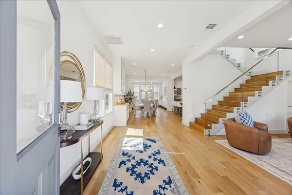 a view of living room and wooden floor