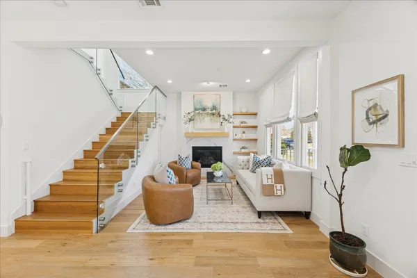 a living room with furniture and a fireplace