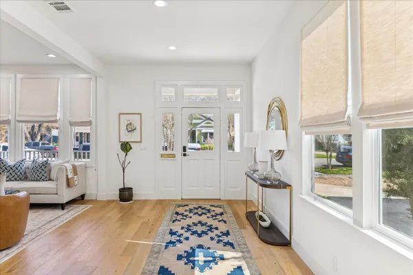 a bedroom with furniture and a window