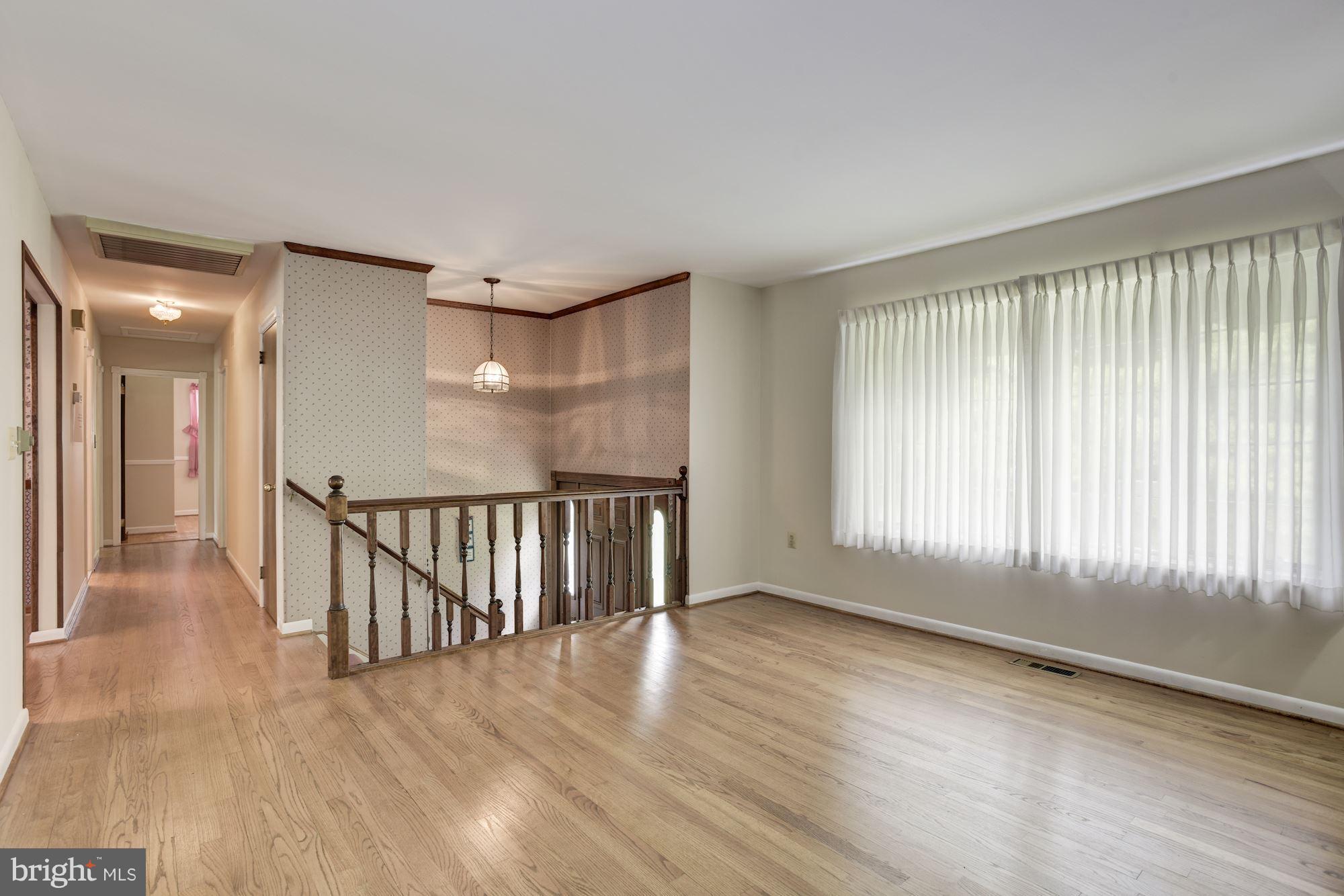 2514 Braddock Road Mount Airy, MD 21771 - Photo 2 of 30 a view of an empty room with wooden floor and a window