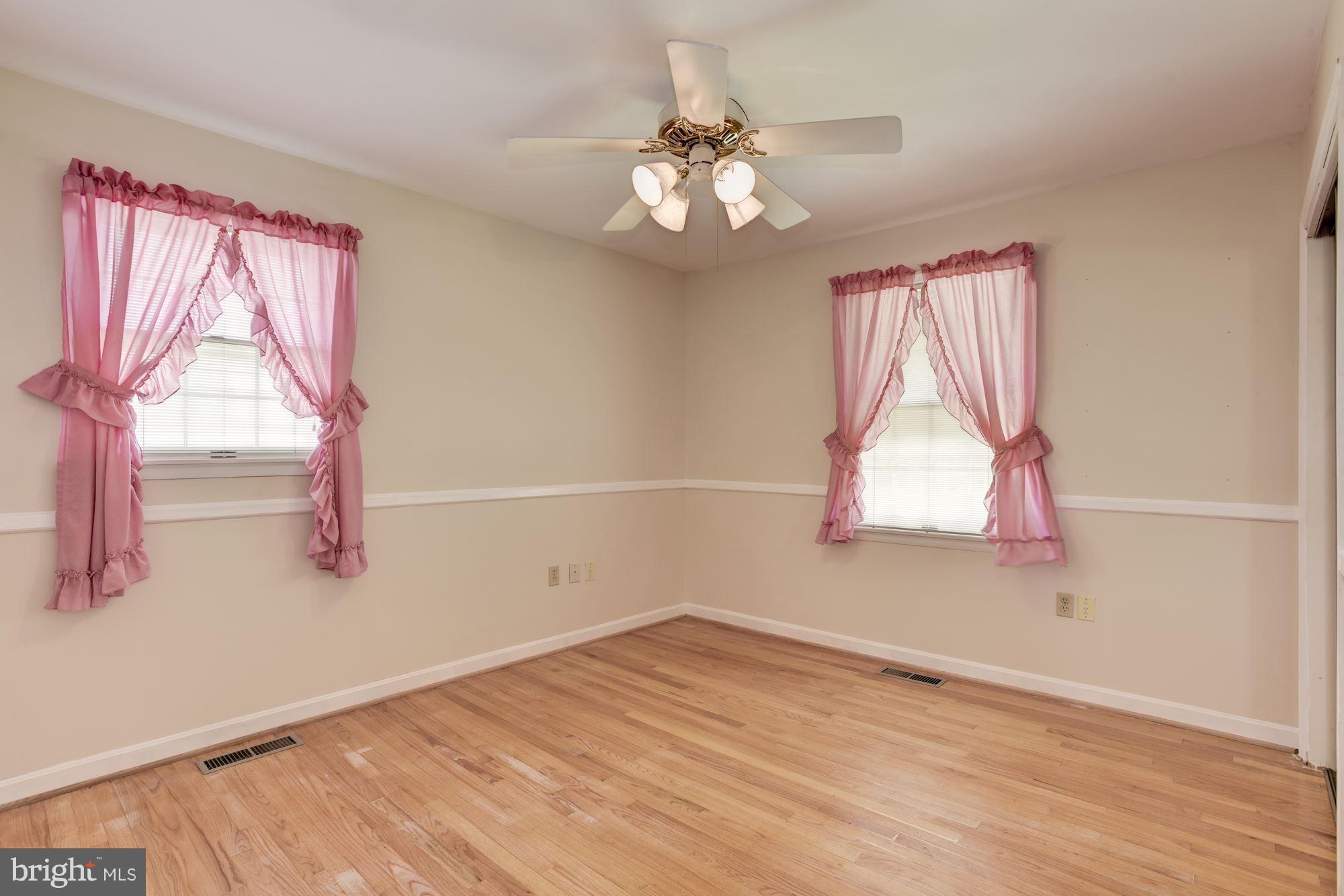 2514 Braddock Road Mount Airy, MD 21771 - Photo 13 of 30 a view of empty room with wooden floor and fan
