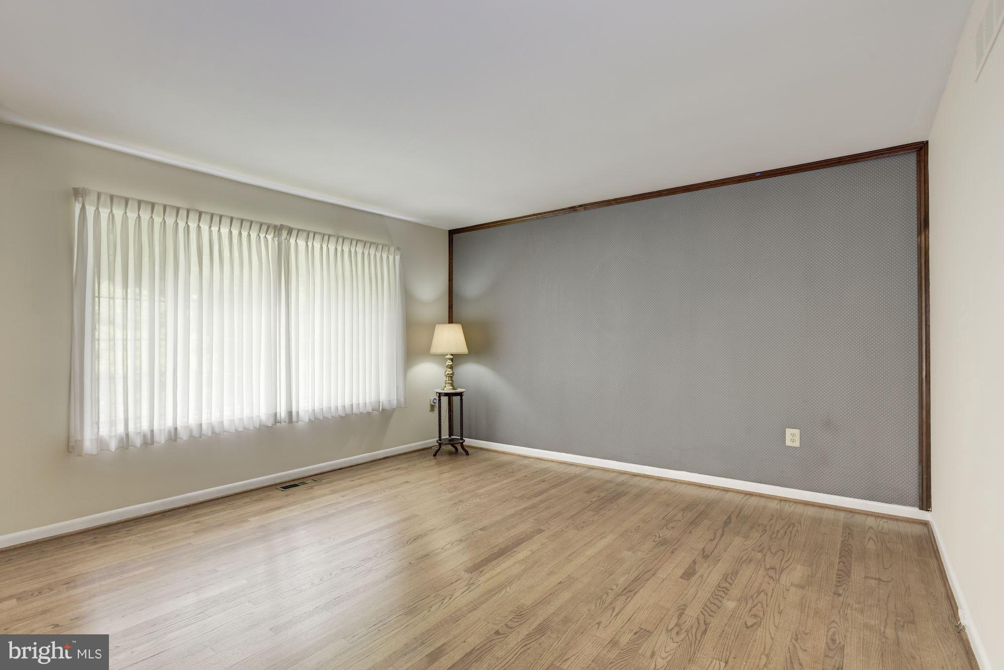 2514 Braddock Road Mount Airy, MD 21771 - Photo 3 of 30 an empty room with wooden floor and windows