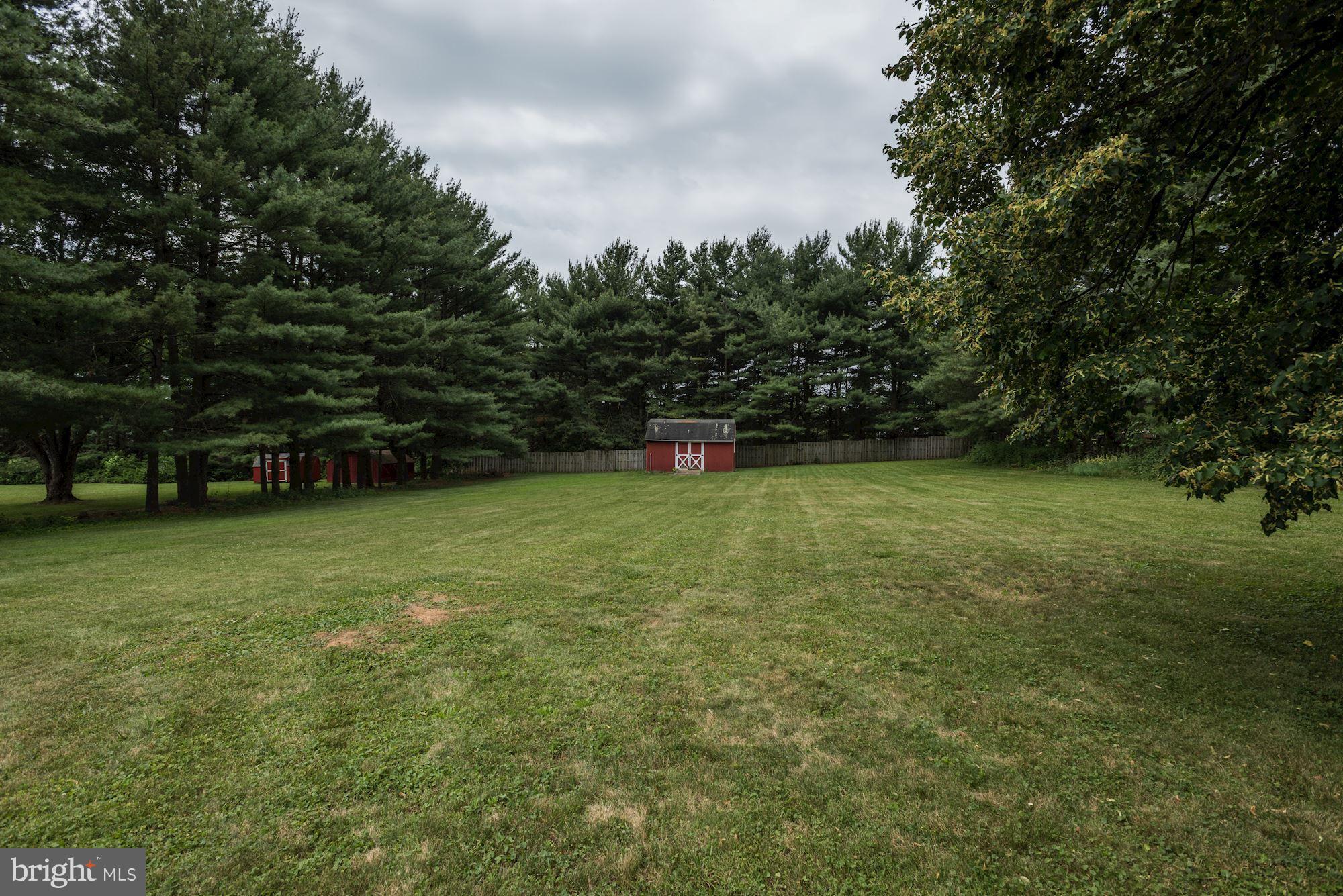 2514 Braddock Road Mount Airy, MD 21771 - Photo 28 of 30 a view of a green field with trees in the background