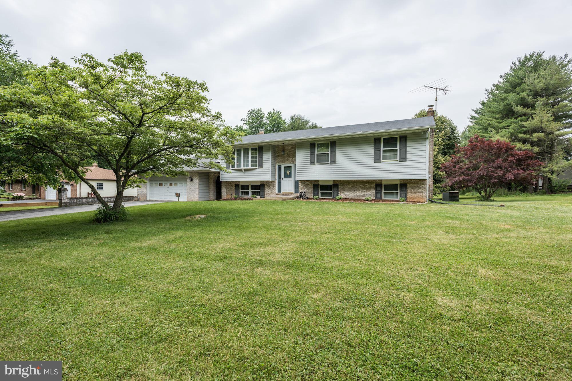 2514 Braddock Road Mount Airy, MD 21771 - Photo 29 of 30 a front view of a house with a yard