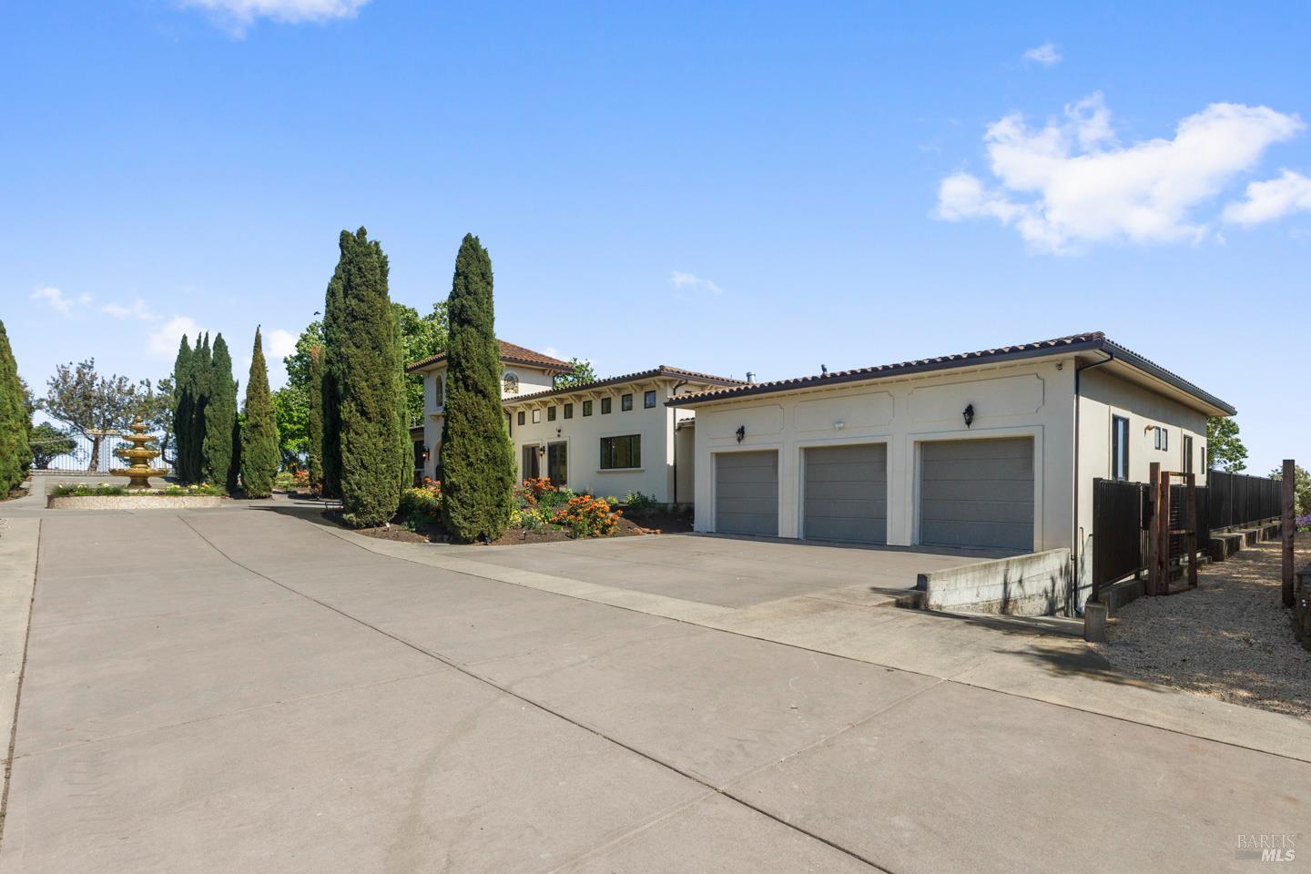 3001 Sears Point Road Sonoma, CA 95476 - Photo 13 of 52 a front view of a house with a yard and garage