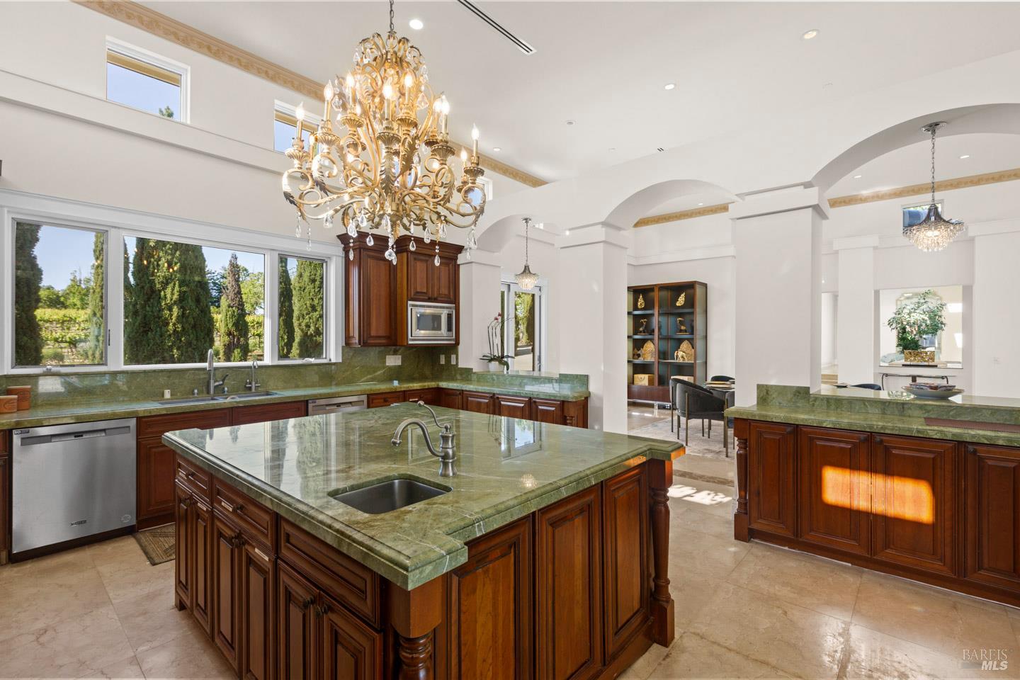 3001 Sears Point Road Sonoma, CA 95476 - Photo 19 of 52 a kitchen with a stove sink and chandelier