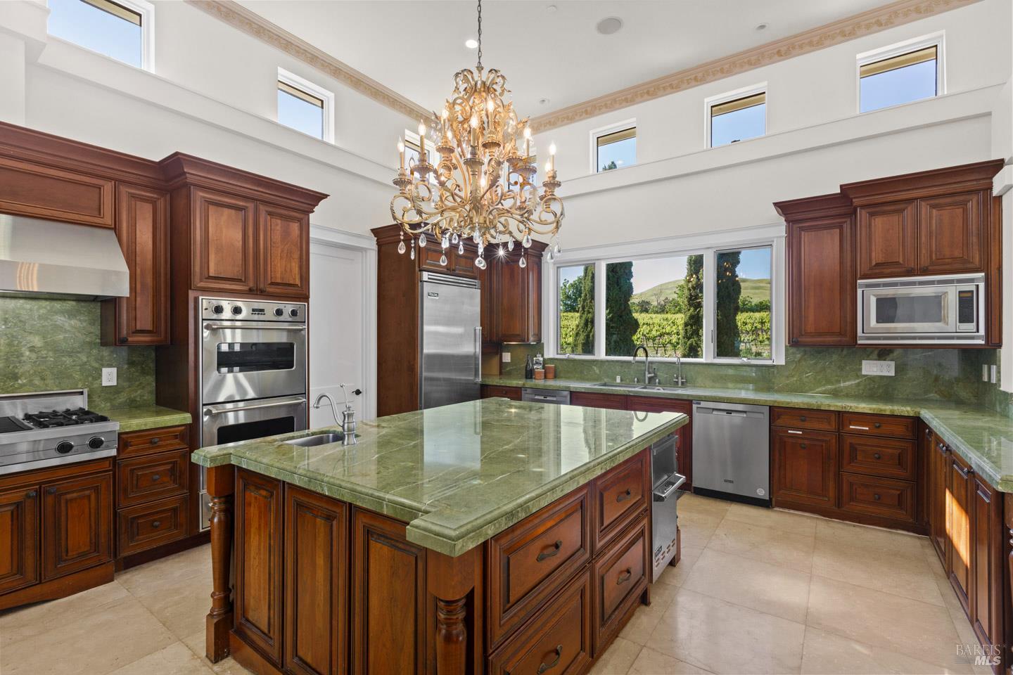 3001 Sears Point Road Sonoma, CA 95476 - Photo 20 of 52 a kitchen with kitchen island granite countertop a sink stainless steel appliances and chandelier