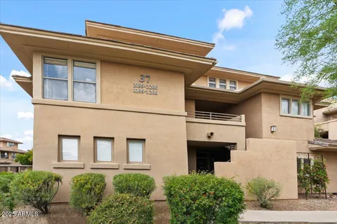 a front view of a house with a garage