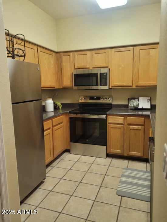 20100 North 78th Place, Unit 2203 Scottsdale, AZ 85255 - Photo 11 of 35 a kitchen with stainless steel appliances granite countertop a refrigerator sink and microwave