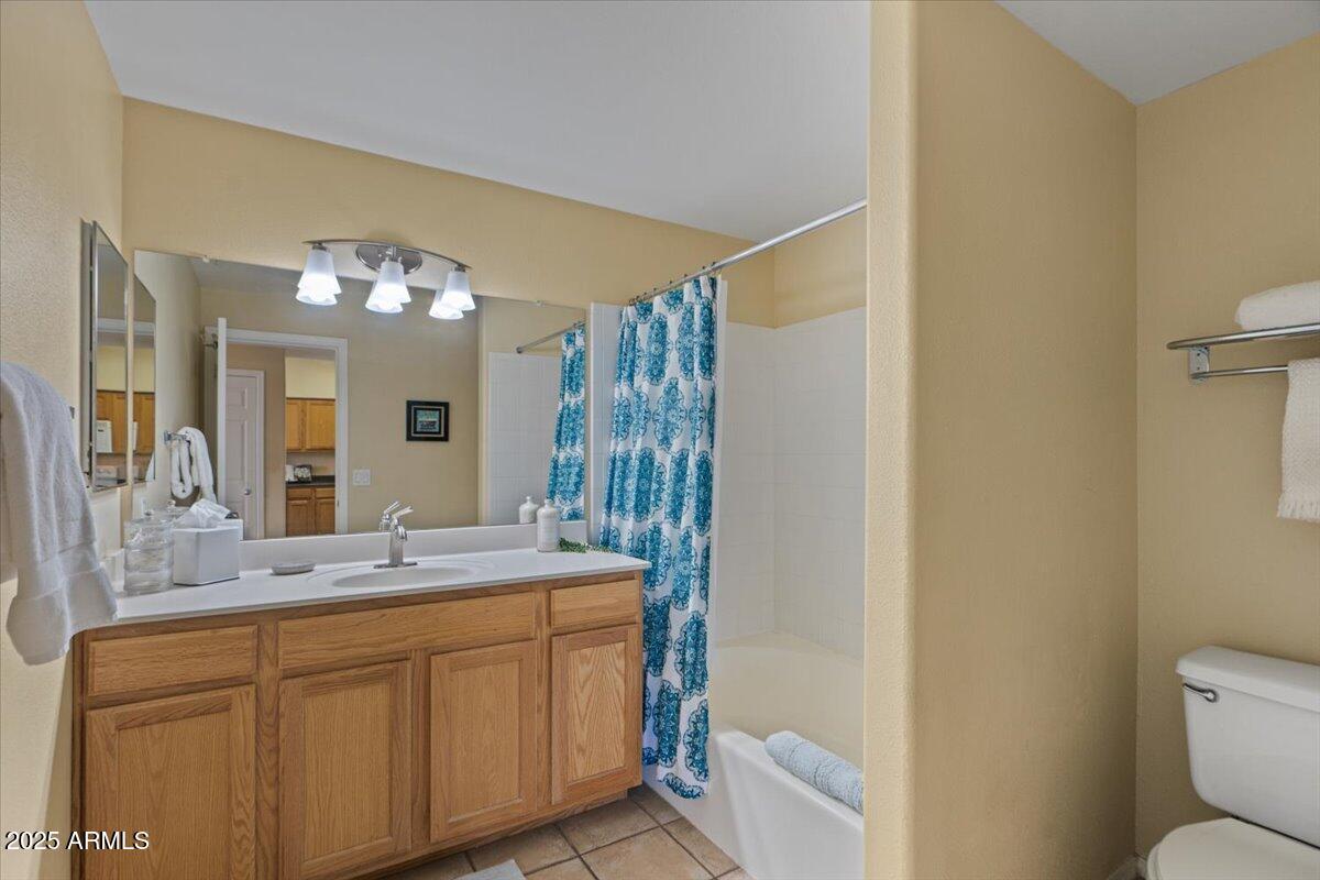 20100 North 78th Place, Unit 2203 Scottsdale, AZ 85255 - Photo 17 of 35 a bathroom with a double vanity sink mirror and toilet