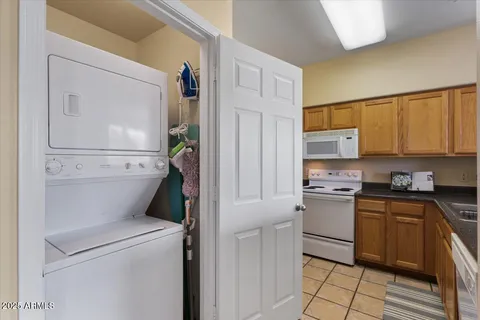 a kitchen with a refrigerator and cabinets