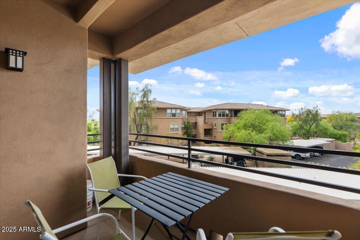 20100 North 78th Place, Unit 2203 Scottsdale, AZ 85255 - Photo 21 of 35 a view of a balcony with chairs