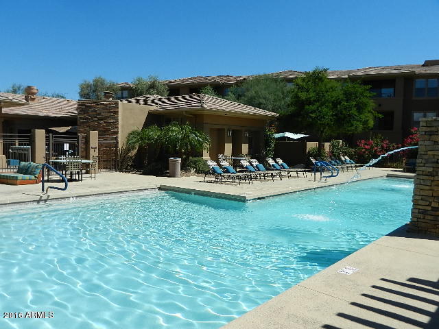 20100 North 78th Place, Unit 2203 Scottsdale, AZ 85255 - Photo 27 of 35 a view of outdoor space yard deck patio and fire pit