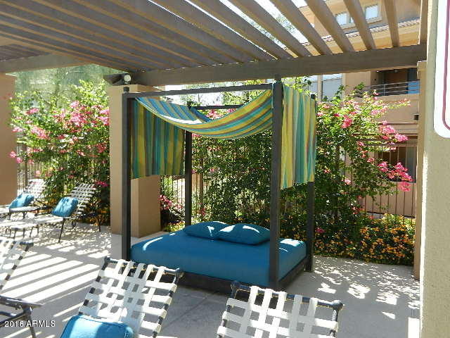 20100 North 78th Place, Unit 2203 Scottsdale, AZ 85255 - Photo 28 of 35 a outdoor living space with furniture and garden view