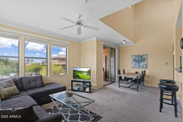 a living room with furniture and a window