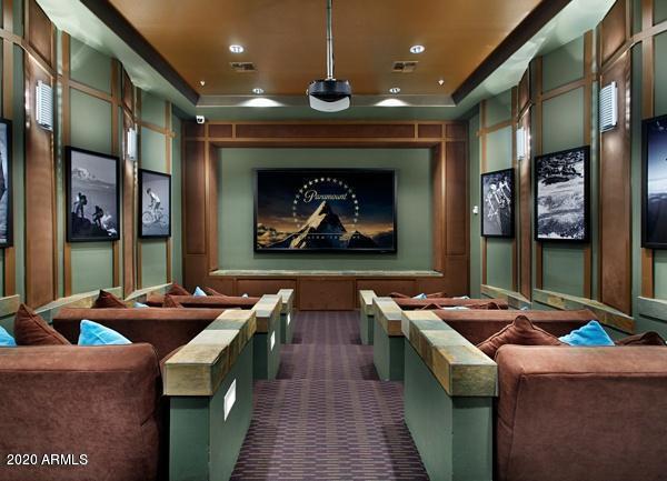 20100 North 78th Place, Unit 2203 Scottsdale, AZ 85255 - Photo 31 of 35 a room with furniture and a fireplace