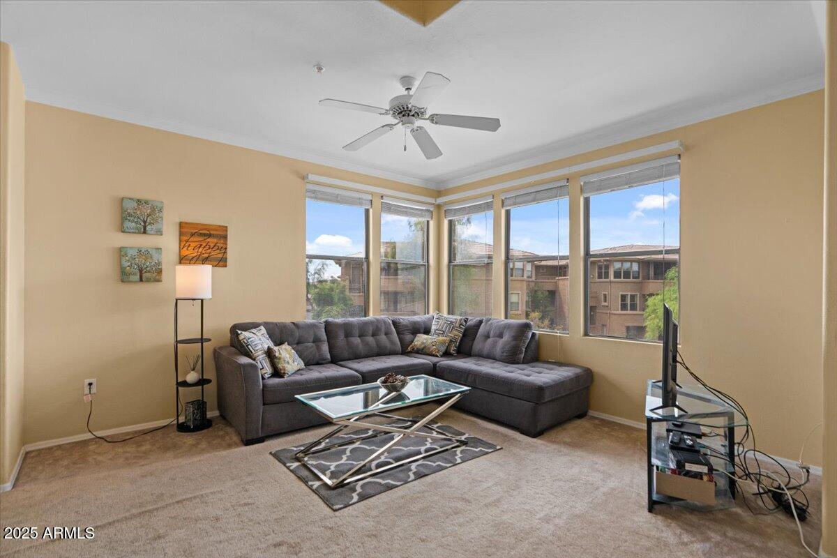 20100 North 78th Place, Unit 2203 Scottsdale, AZ 85255 - Photo 5 of 35 a living room with furniture and a large window