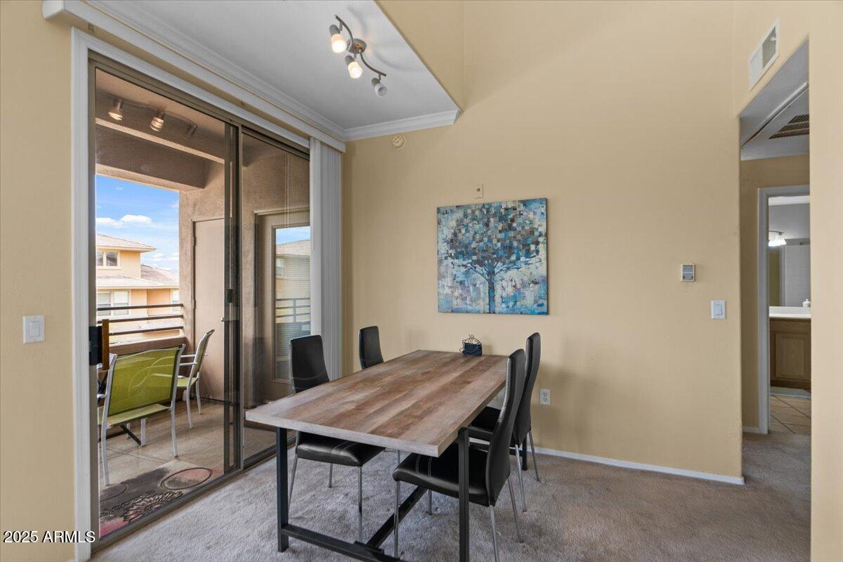 20100 North 78th Place, Unit 2203 Scottsdale, AZ 85255 - Photo 6 of 35 a view of a dining room with furniture