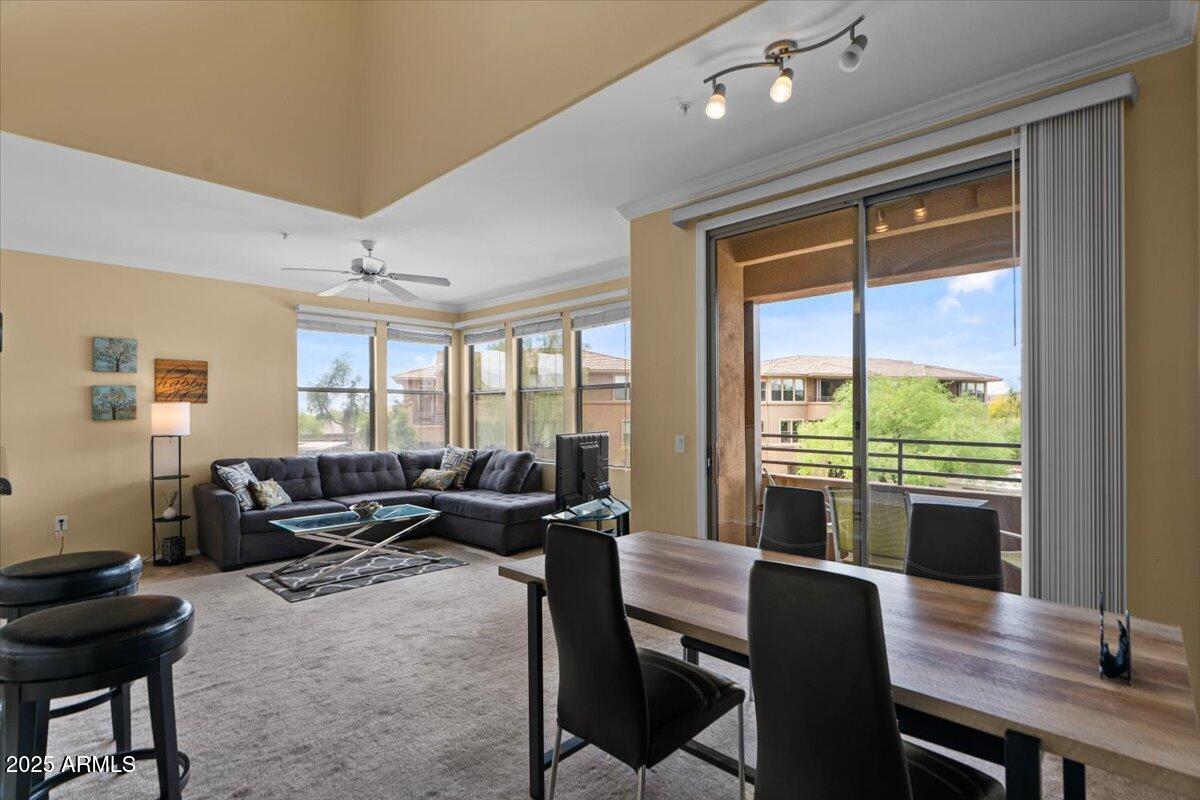 20100 North 78th Place, Unit 2203 Scottsdale, AZ 85255 - Photo 8 of 35 a living room with furniture and large windows