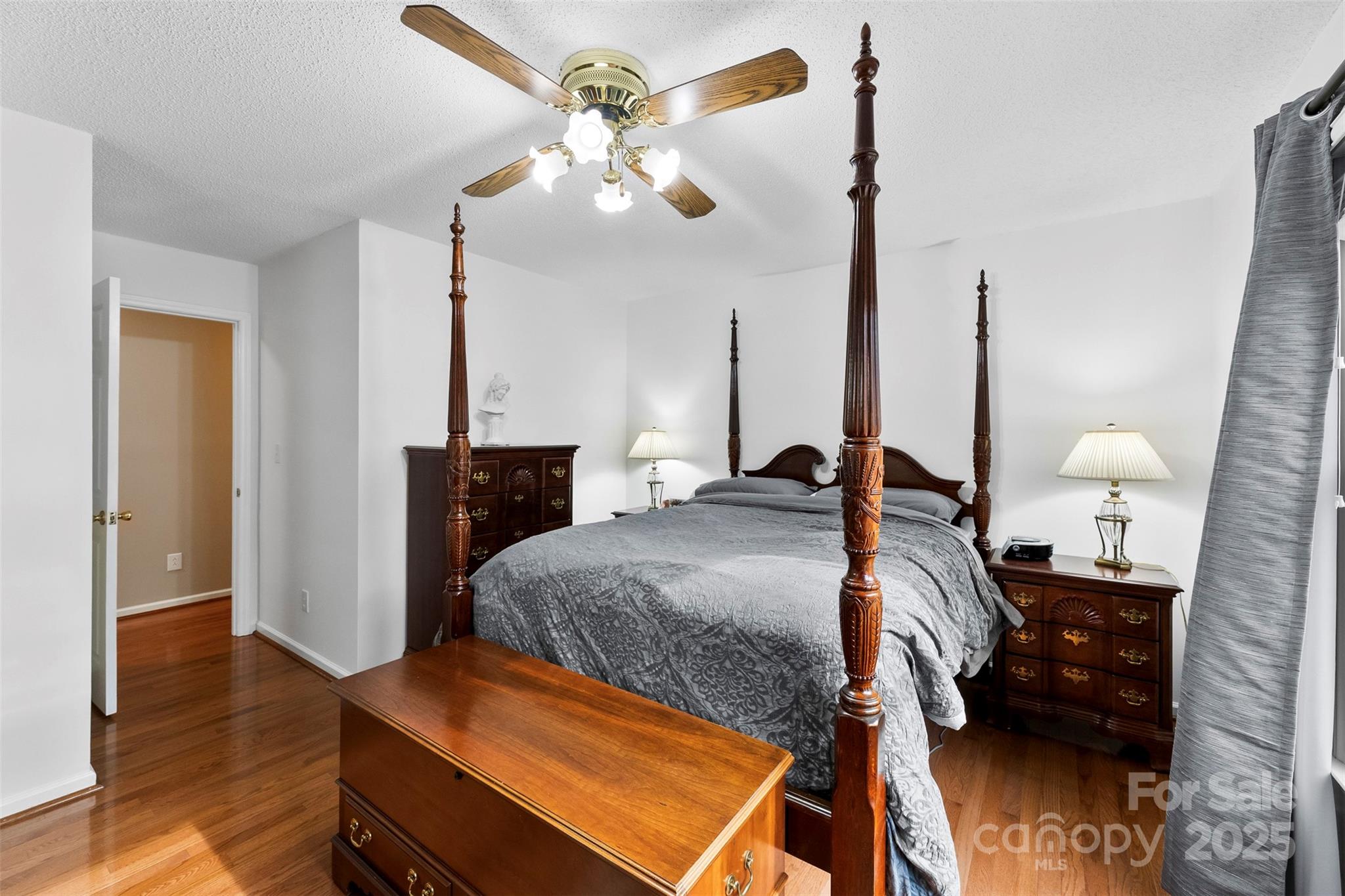 715 Deese Road Monroe, NC 28110 - Photo 13 of 28 a bed room with a bed and a lamp