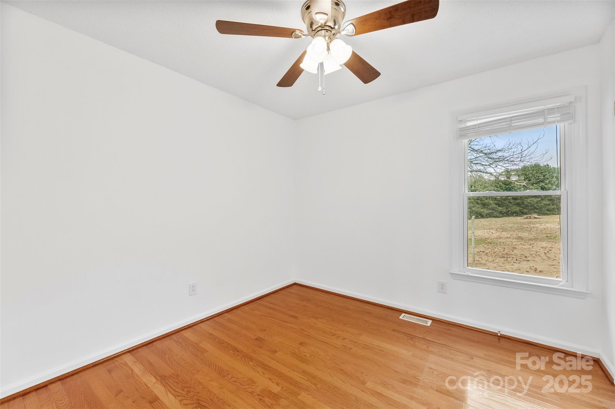 715 Deese Road Monroe, NC 28110 - Photo 16 of 28 an empty room with a window and a fan