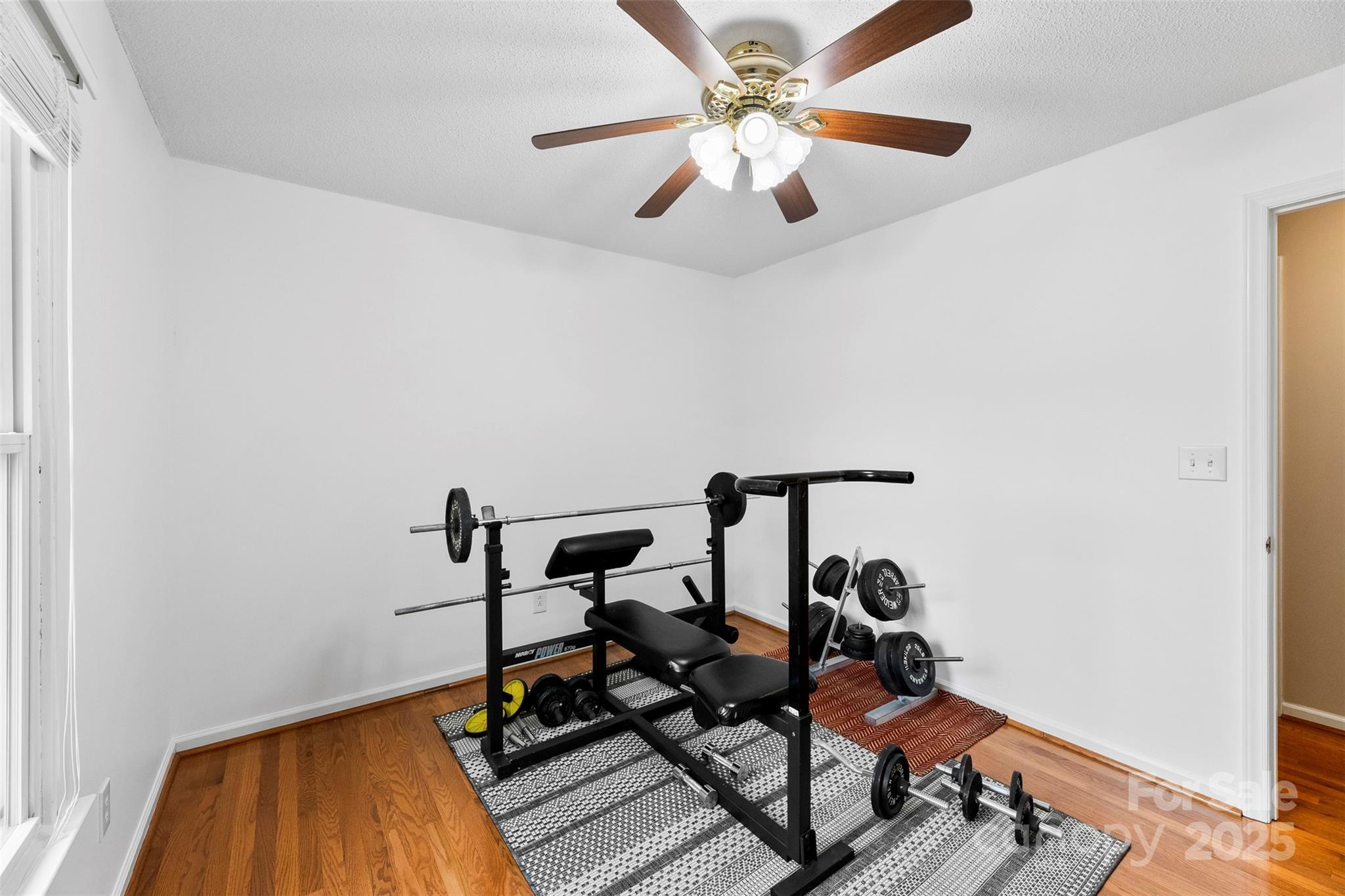 715 Deese Road Monroe, NC 28110 - Photo 21 of 28 a view of a workspace with wooden floor