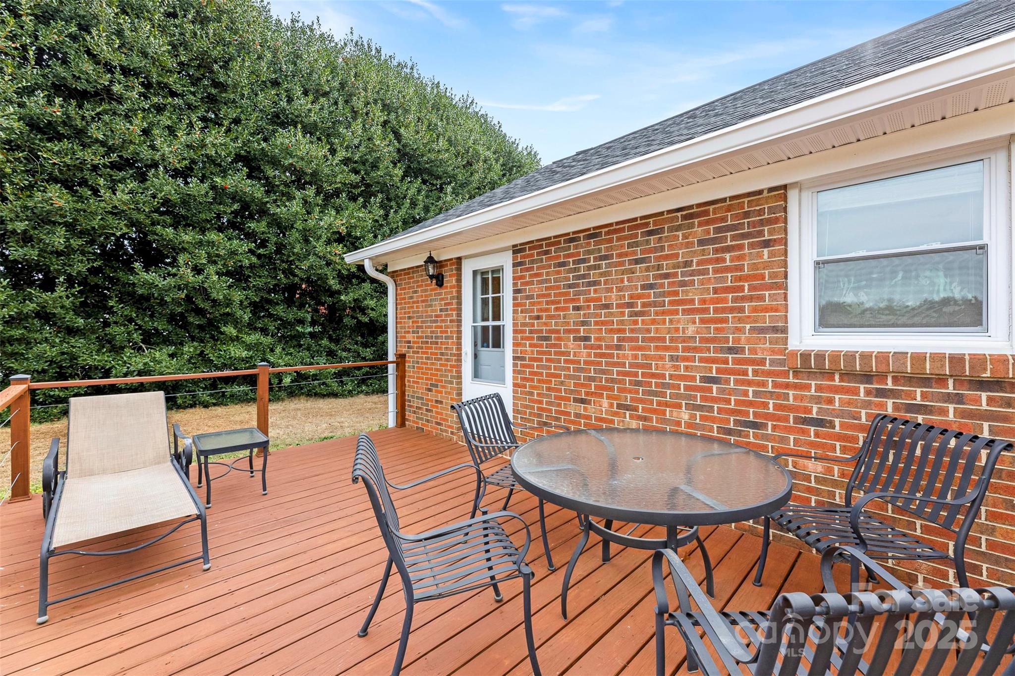 715 Deese Road Monroe, NC 28110 - Photo 25 of 28 a balcony with table and chairs