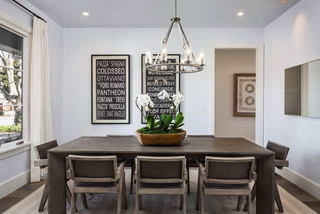a view of a dining room with furniture and window