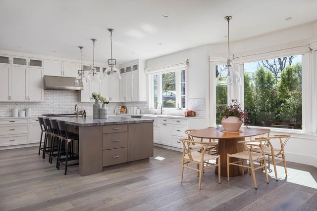 a view of a dining room with furniture window and outside view