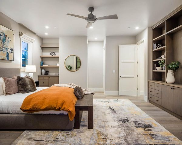 a bathroom with a granite countertop sink a toilet and shower