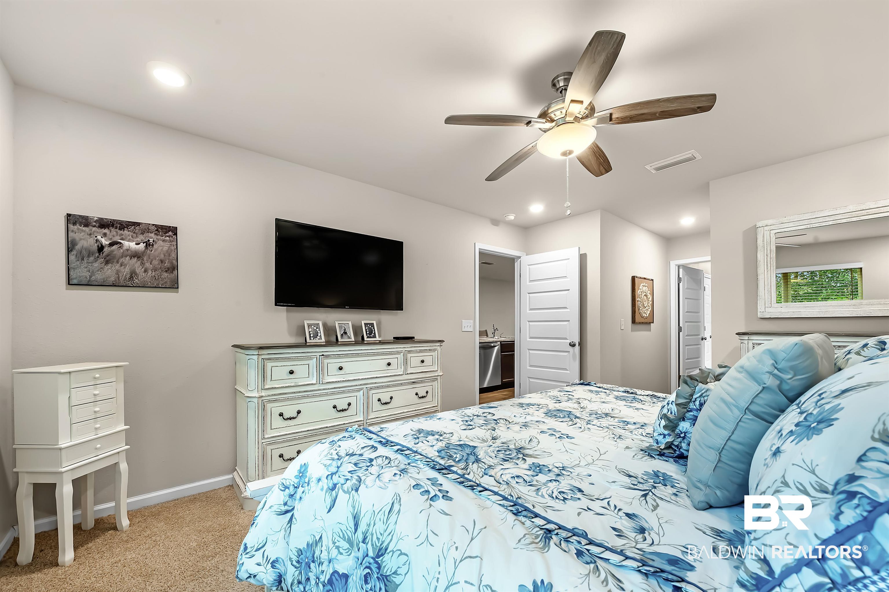 17985 Lewis Smith Drive Foley, AL 36535 - Photo 26 of 56 Bedroom featuring ceiling fan and light carpet