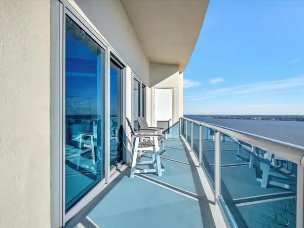 a view of balcony with furniture