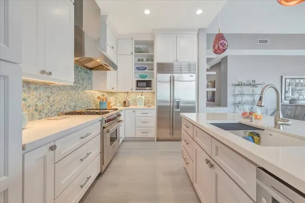 a kitchen with cabinets and window