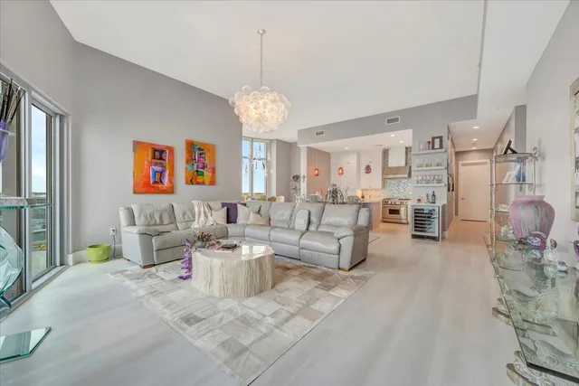 a view of balcony with two chairs and wooden floor