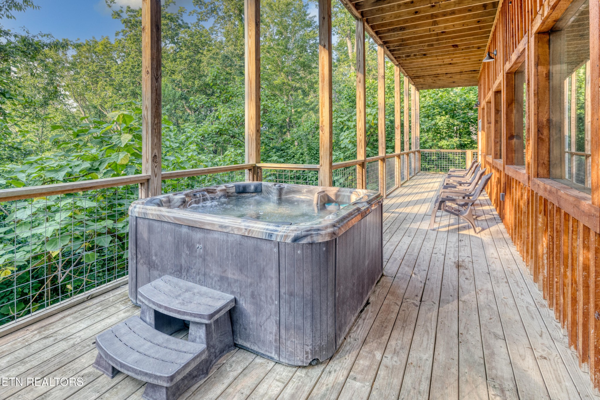 809 Pinecrest Way Sevierville, TN 37862 - Photo 31 of 60 a balcony with furniture and wooden floor