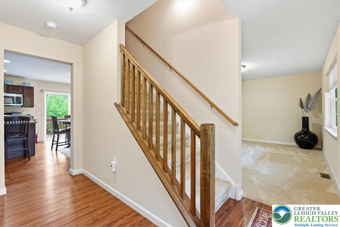 5032 Custard Road Stroudsburg, PA 18360 - Photo 14 of 80 Gleaming hardwood floors and classic wood railings guide the way through this open multi-level layout.